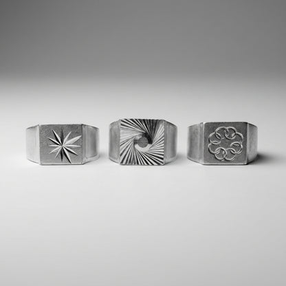 Chevalières aluminium Le Tirage : motifs Étoile, Vortex et Anneaux